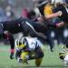 Purdue line backer Antwon Higgs sails over Michigan linebacker Brandin Hawthorne during a kick return in the fourth quarter at Ross-Ade Stadium in West Lafayette, Indiana on Saturday. Melanie Maxwell I AnnArbor.com